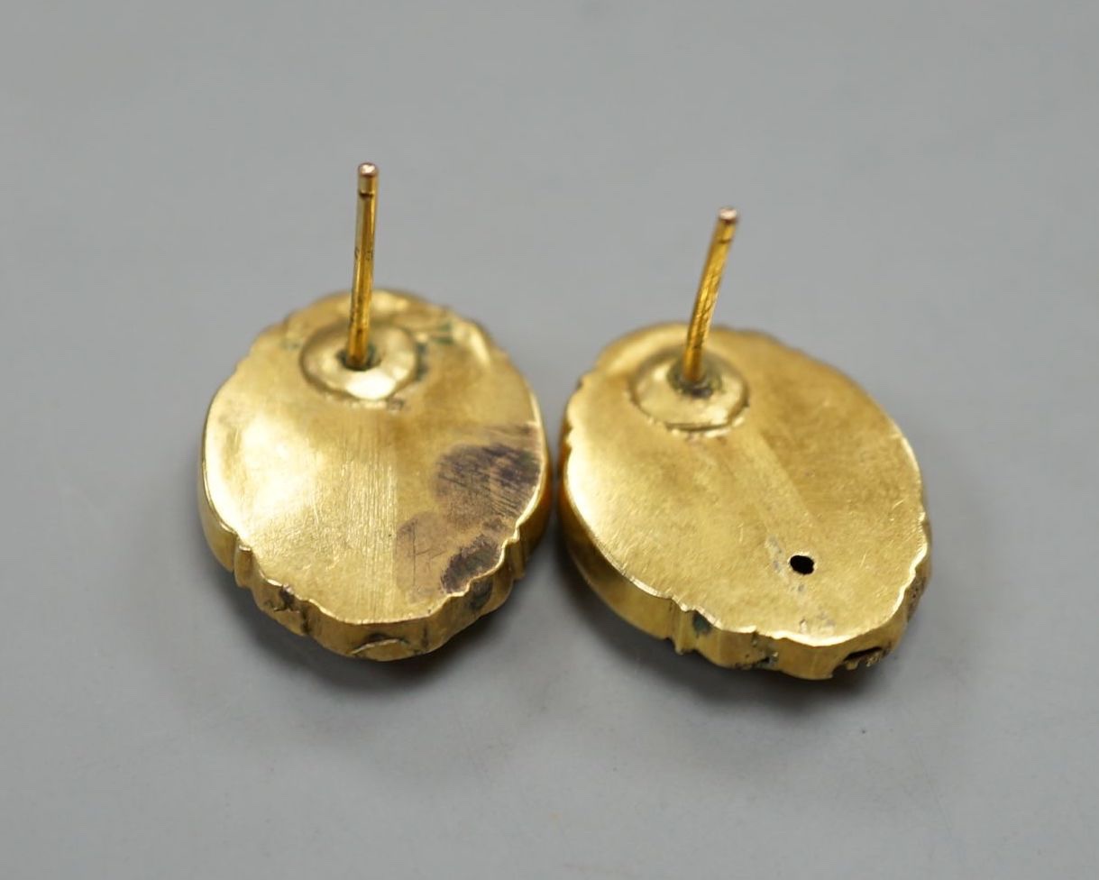 A pair of Victorian yellow metal ovoid ear studs(a.f.), 5 grams.